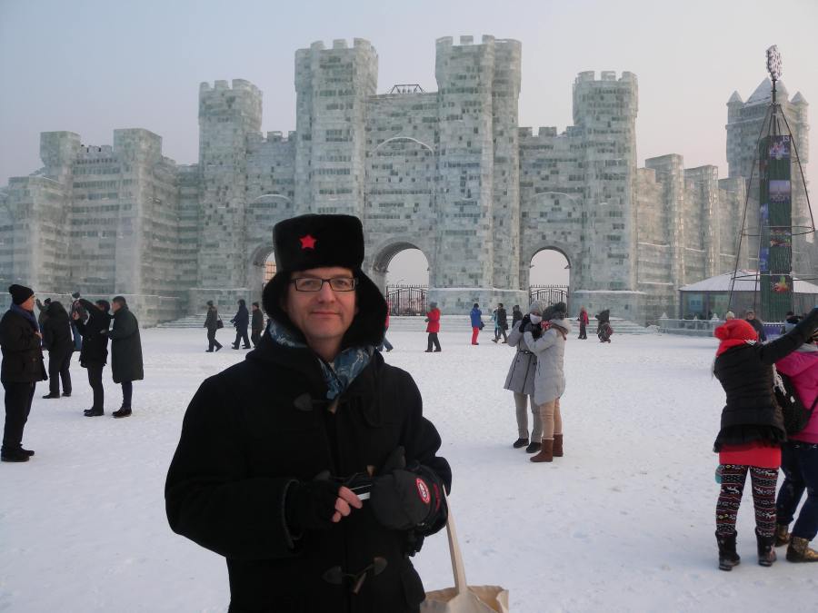 aspiring member of communist party central committee, who strangely shadowed me around Harbin, in front of impressive ice castle