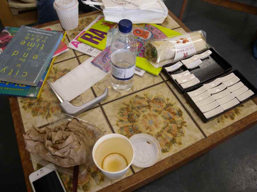 Discussion of upcoming exhibition in Unit Gallery, so far categorised as works in progress and the nascent audience and coffee table accordingly covered in related stuff, in other words a living record of productivity, a still life.
