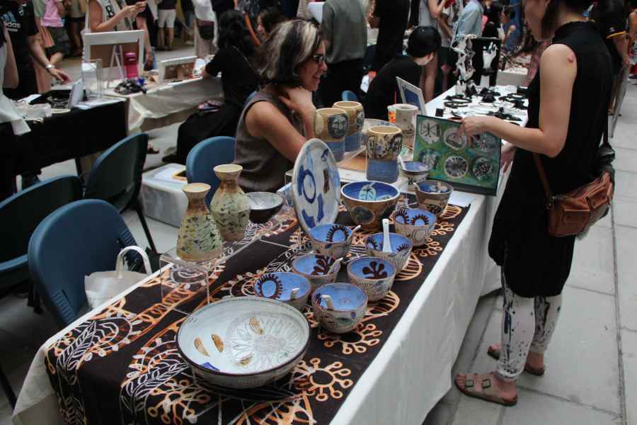 discussing portfolio with an interested visitor